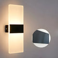 Modern acrylic wall-mounted LED bedside lamp in silver finish showing warm light illumination