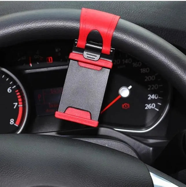 Black universal steering wheel phone mount clip holding a smartphone for hands-free use while driving.