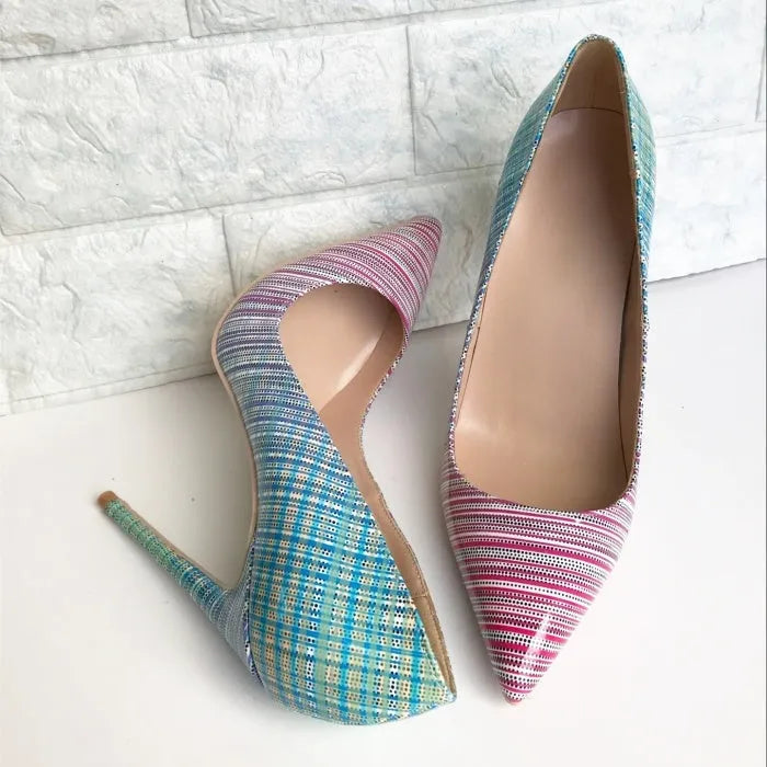 Ladies pink-blue gradient patent leather pointed toe stiletto heels with a tall thin heel on a rubber sole.