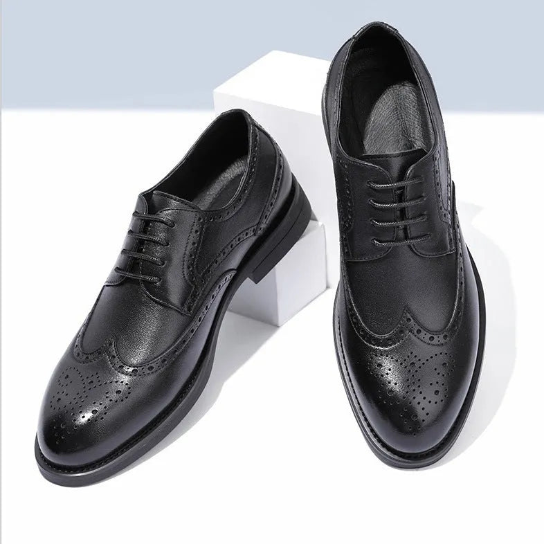 Men's black brogue formal shoes with a lace-up front and perforated detail.