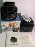 Black wrist blood pressure monitor with USB charging cable.