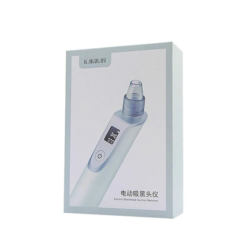 White handheld ultrasonic facial cleansing instrument with interchangeable suction heads on a clean surface.