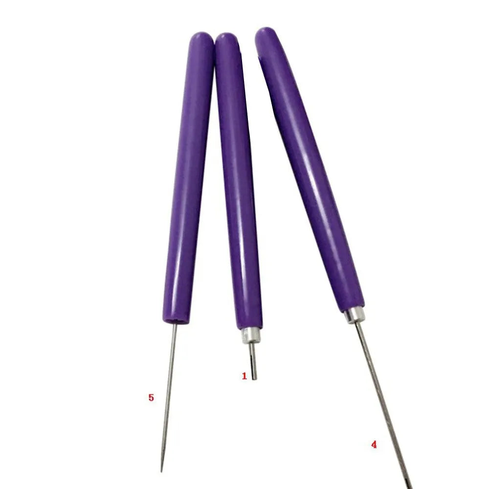 Five purple quilling pens with slotted tips and a stylus laid out on a surface