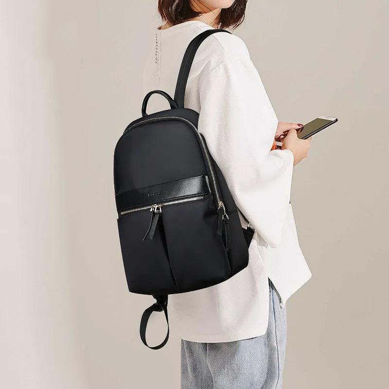 Women's nylon backpack computer bag under 20L with zip closure, laptop insert, phone pocket and certificate bag in Black or Pink