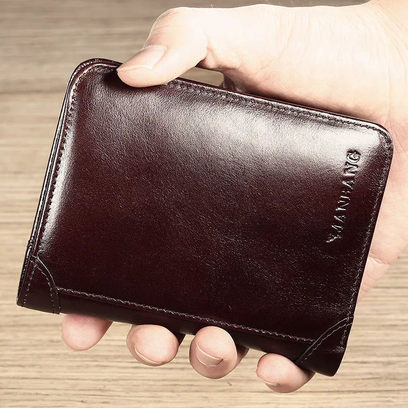 Men's black genuine leather bi-fold wallet open, showing eight card slots, a note compartment, and a zipped coin pouch.