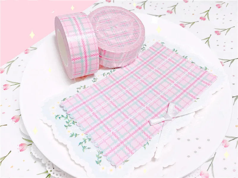 Eight rolls of decorative plaid paper tape in blue green pink purple and yellow with release paper backing 2cm x 10M