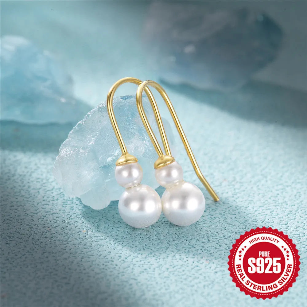 S925 sterling silver geometric earrings with a golden sunflower zircon design.
