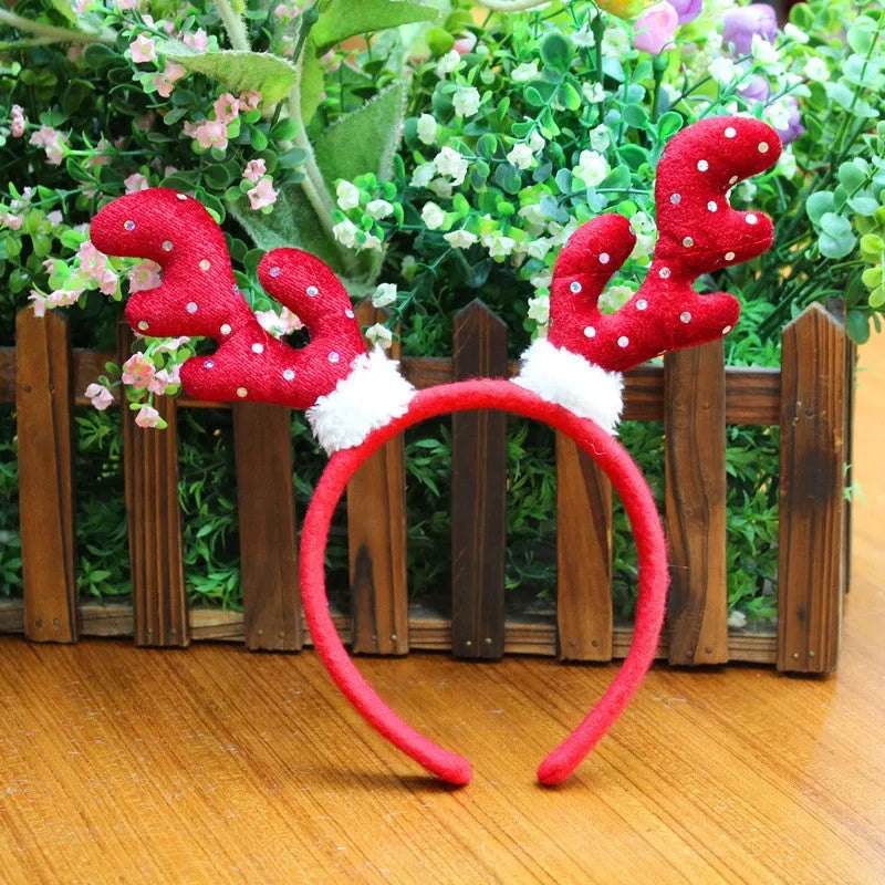 Five Christmas head buckles in different styles including hat, top hat, giraffe, deer, and antlers, made of plastic and flannel