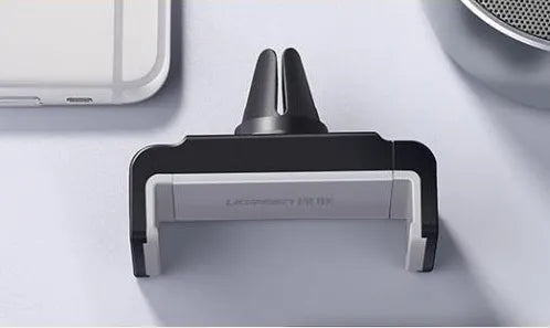 Universal car phone holder in PC and ABS, shown in Black or Grey, for hands-free in-car phone positioning.