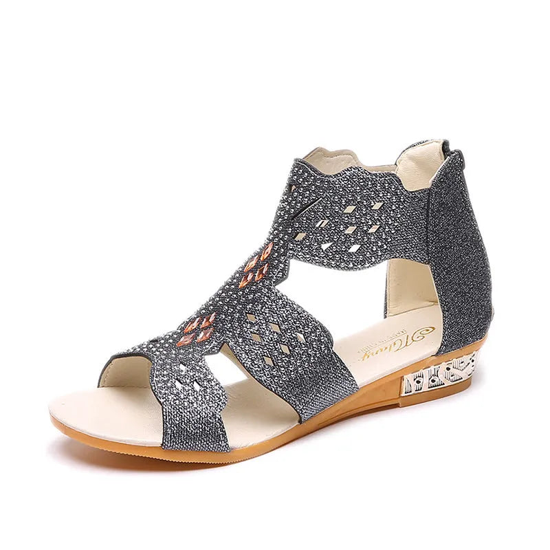 Women's flat open-toe sandals with rhinestones, hollow design, and a back zipper in beige.