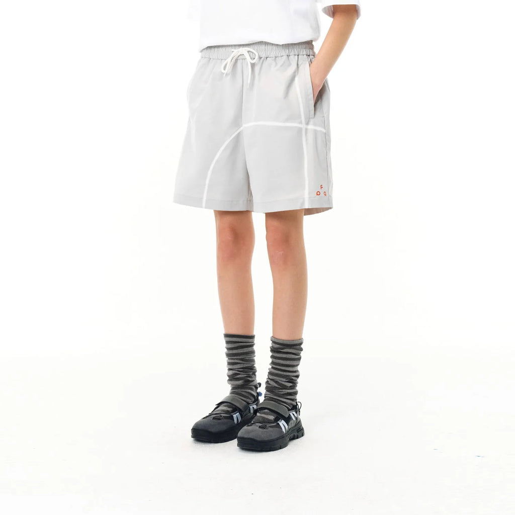 Men's dark grey elastic polyester drawstring shorts with loose fit on a white background.