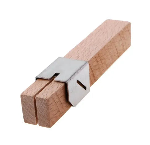 Plastic bottle cutter in log colour, 2.2 by 2.2 by 14 cm, on a table