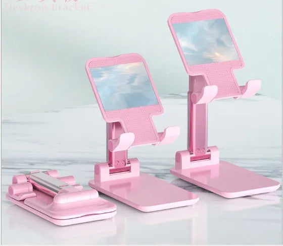 Black mobile phone desk holder with silicone cradle on wooden desk