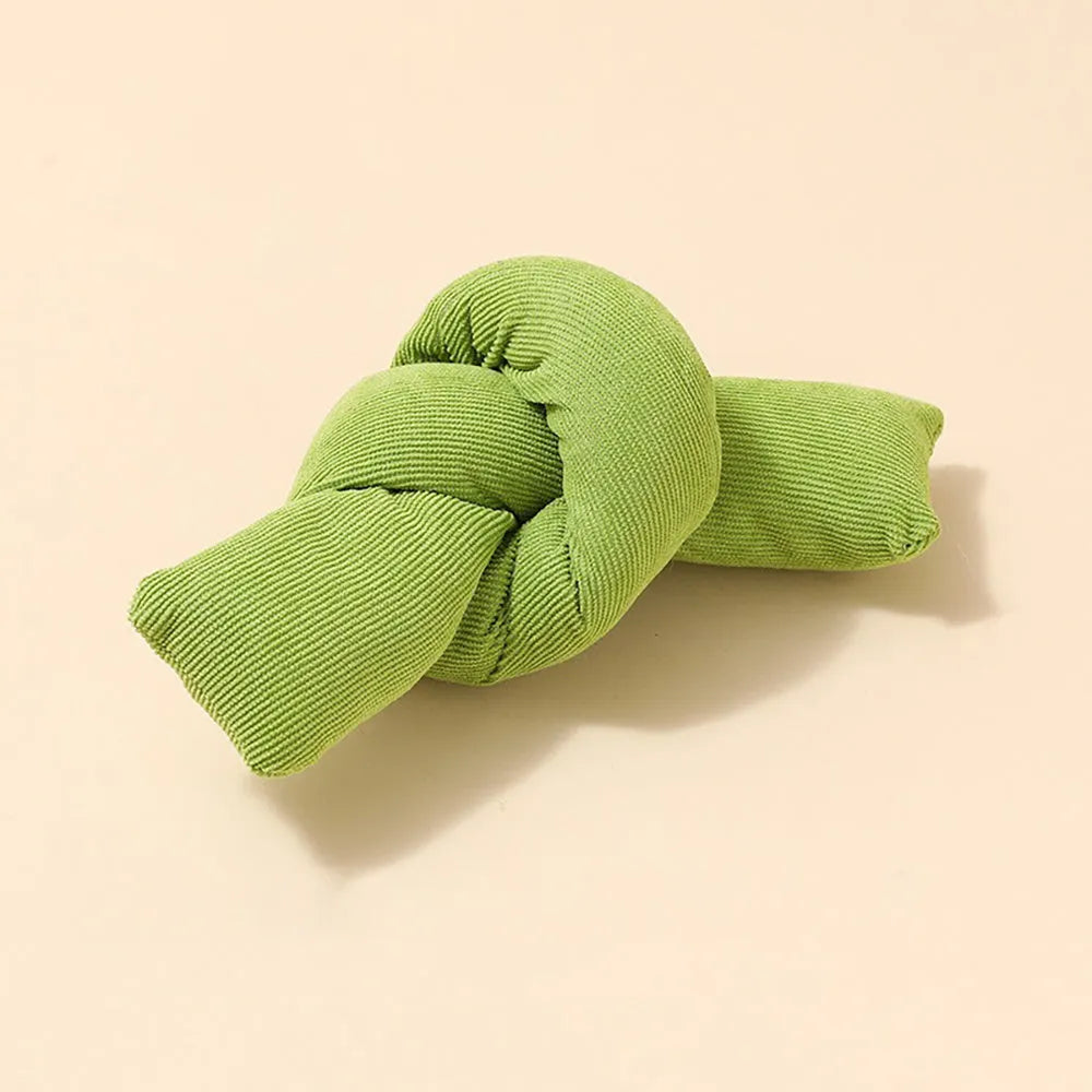 White knotted cotton rope dog toy for chewing and tug of war.