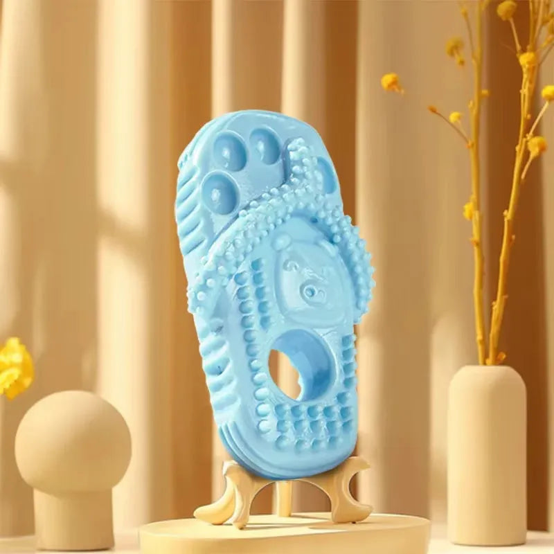 Blue rubber dog chewing toy shaped like a slipper with textured surface for dental cleaning