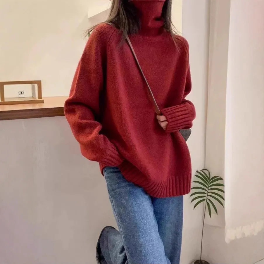 Loose red women's turtleneck sweater with thick curling collar, casual idle style.