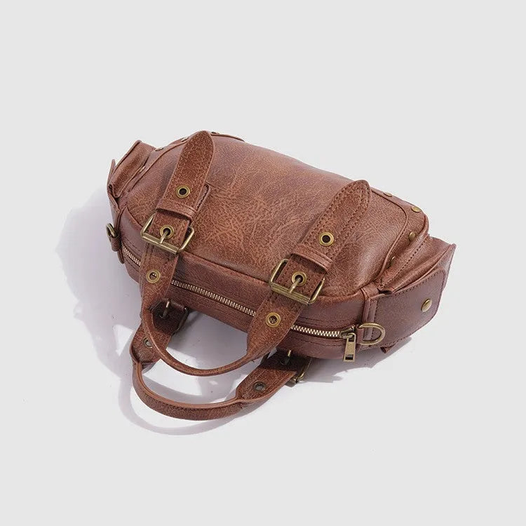 Brown artificial leather motorcycle bag with single shoulder crossbody strap and horizontal square retro shape