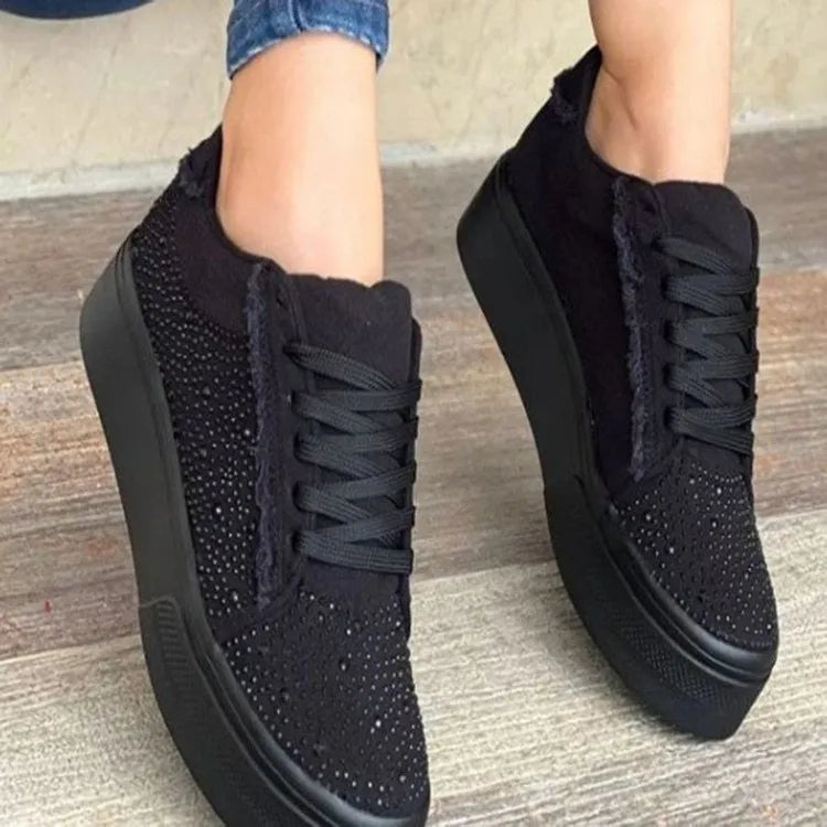 Plus size women's black casual sports shoes with rhinestone detail, flat rubber sole, and lace-up front.