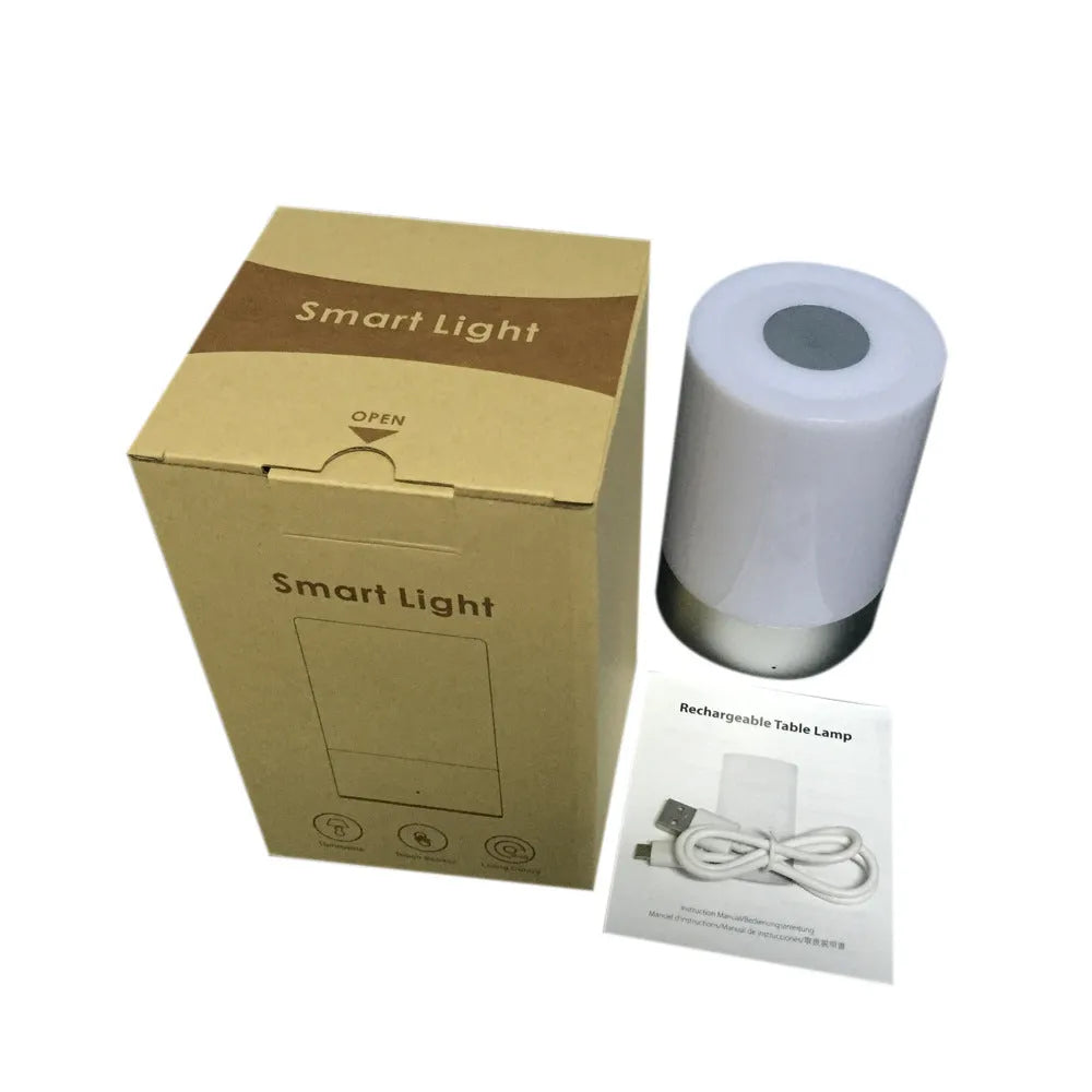 Creative home bedside night light LED lamp with dimmable white and colour light on a desk