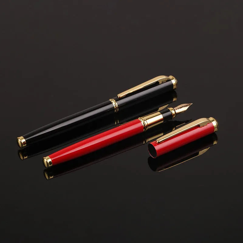 Red and black metal ballpoint pen with a 0.5mm stainless steel nib on a notepad.