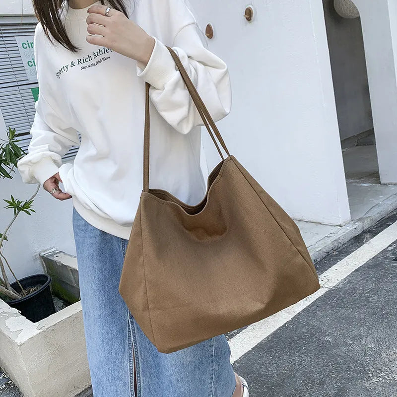 Solid colour canvas women's handbag with double shoulder straps and horizontal square shape