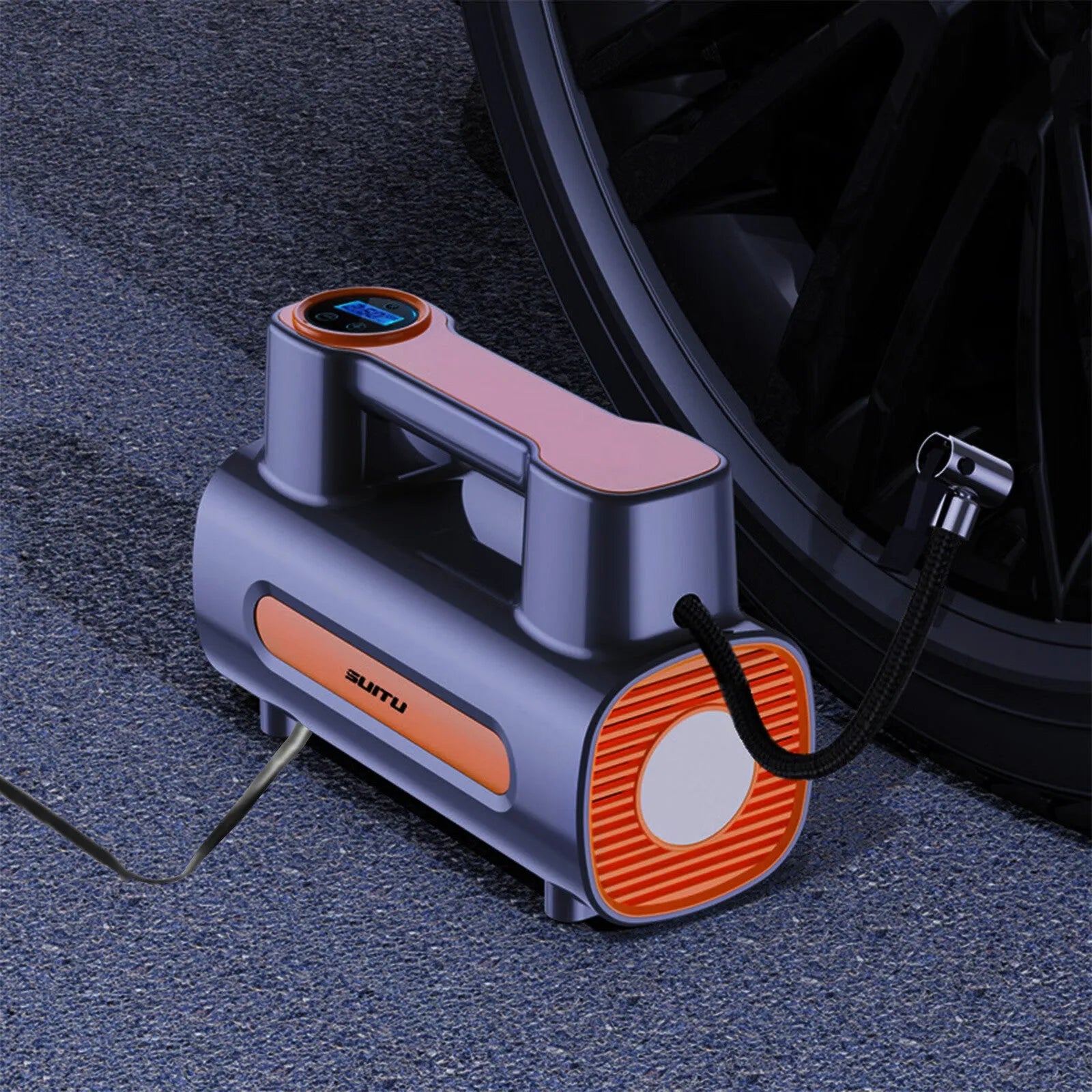 Black portable car tyre inflator with digital LCD screen and USB charging cable on a grey background