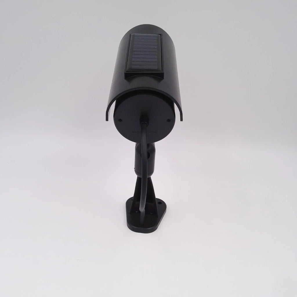 Black gun-style solar dummy camera with flashing red LED light for security deterrent