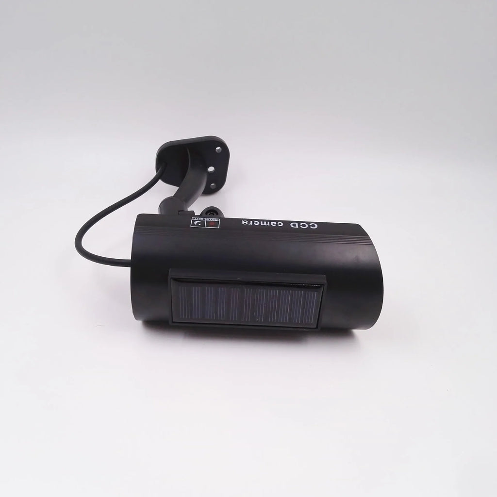 Black gun-style solar dummy camera with flashing red LED light for security deterrent