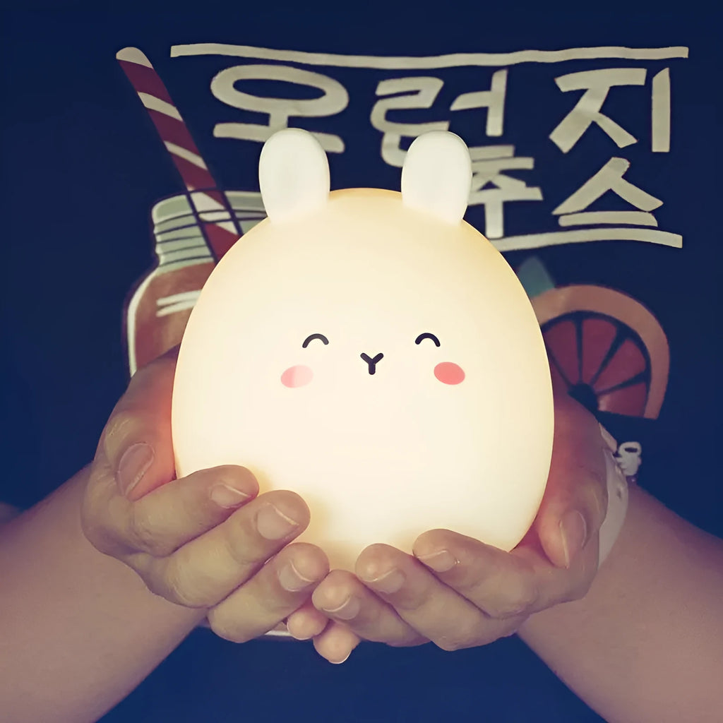 Rechargeable rabbit-shaped night light with silicone construction and LED light source