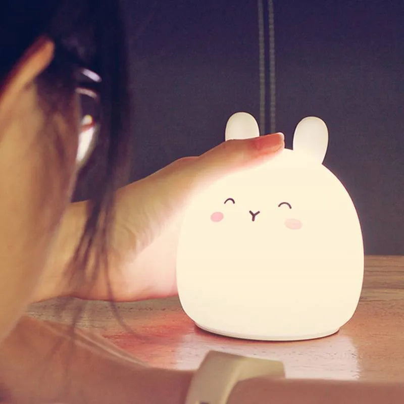 Rechargeable rabbit-shaped night light with silicone construction and LED light source