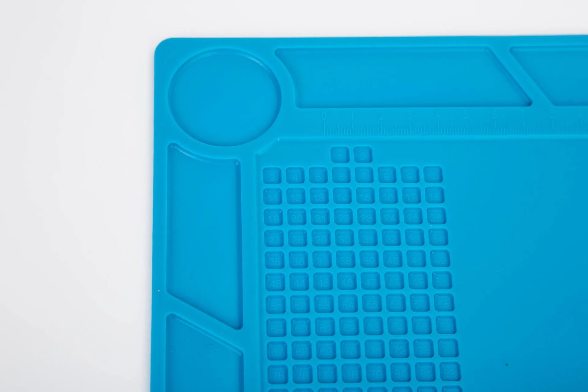 Blue silicone anti-slip desk mat for watch repair with textured surface