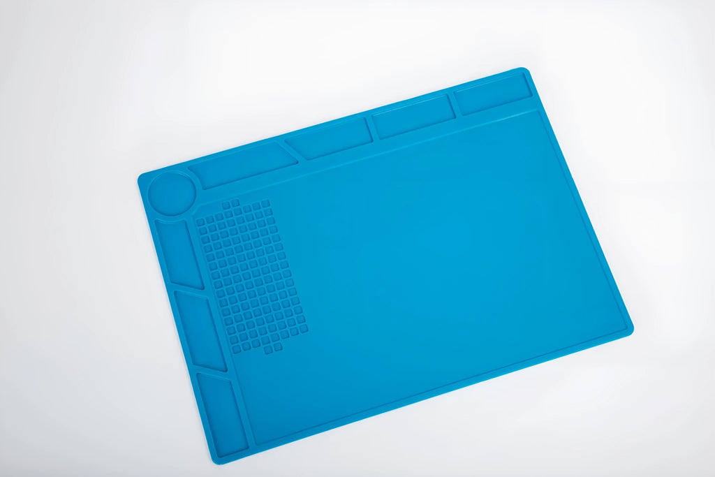 Blue silicone anti-slip desk mat for watch repair with textured surface
