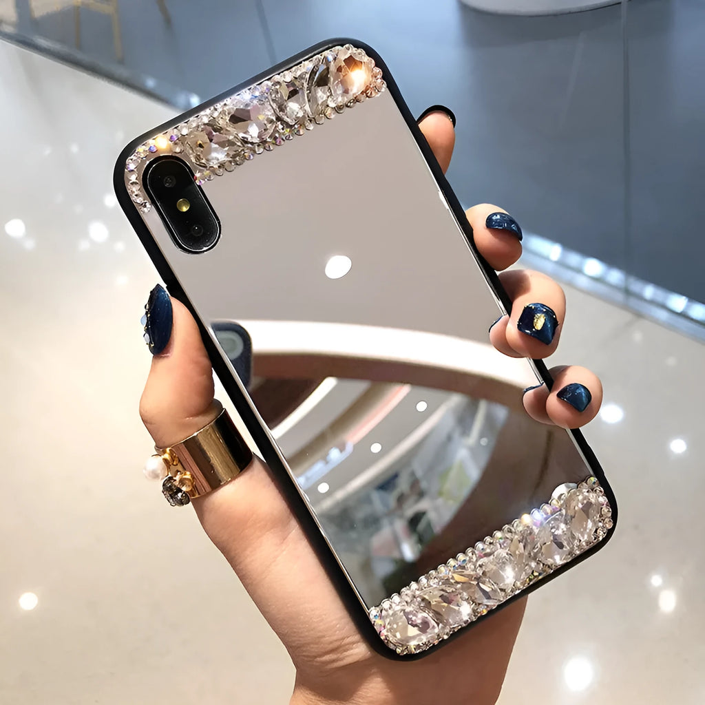Mirror silver soft shell phone case with rhinestones on a white background
