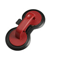 Black and red food-grade ABS plastic burger press mould on a kitchen counter.