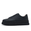 Women's black suede platform trainers with cross-lace binding and thick soles