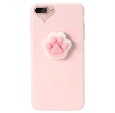 Soft silicone iPhone case with a raised 3D cartoon cat design on the back, shown in pink.