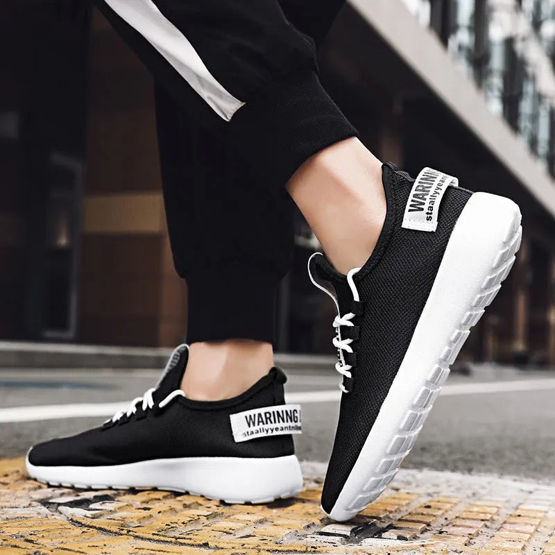 Men's casual breathable sports shoes with flyknit upper and EVA sole, black and yellow colour, plain Korean style design
