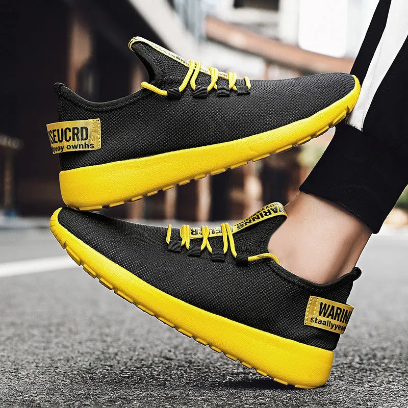 Men's casual breathable sports shoes with flyknit upper and EVA sole, black and yellow colour, plain Korean style design
