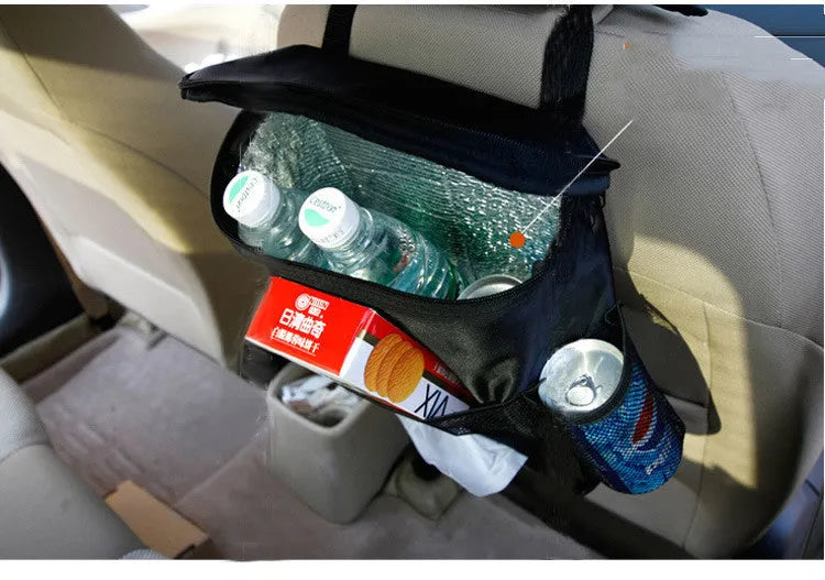 Black 600D Oxford cloth car trash storage bag with adjustable shoulder strap hanging on headrest