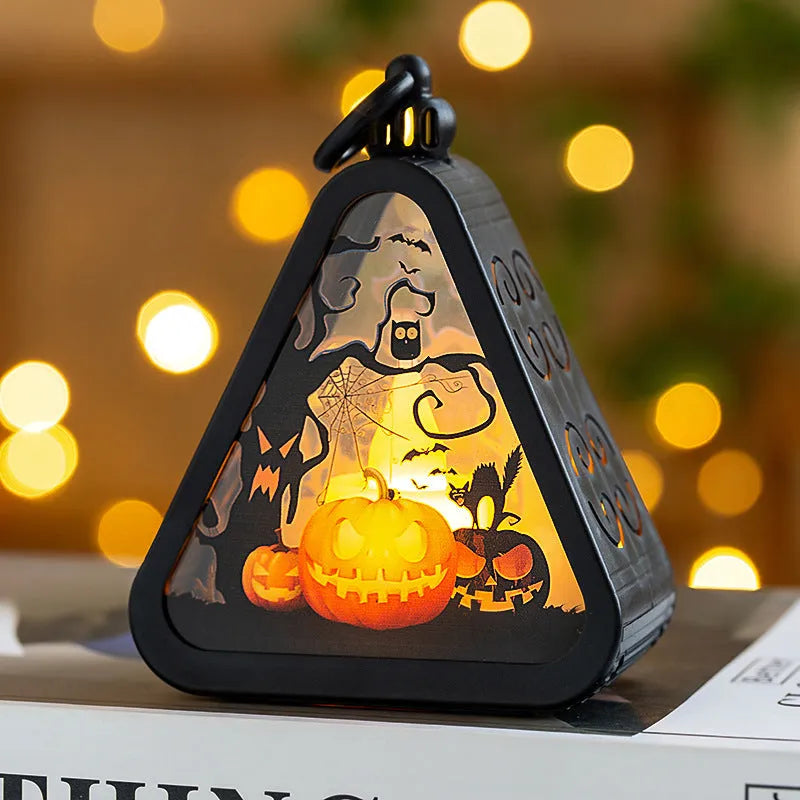 A portable Halloween pumpkin lamp decoration in one of four colour themes: pumpkin, witch, castle, or ghost hand.