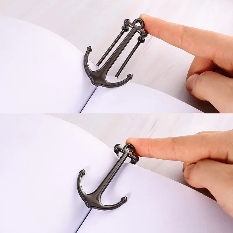 Creative metal bookmark page folder in rose gold colour against an open book
