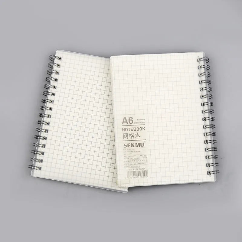 Creative coil notebook open showing grid pages, available in A5, B5, and A6 sizes