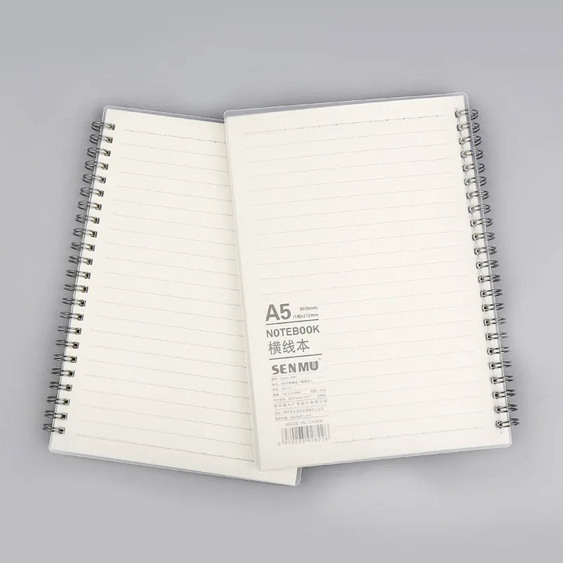 Creative coil notebook open showing grid pages, available in A5, B5, and A6 sizes