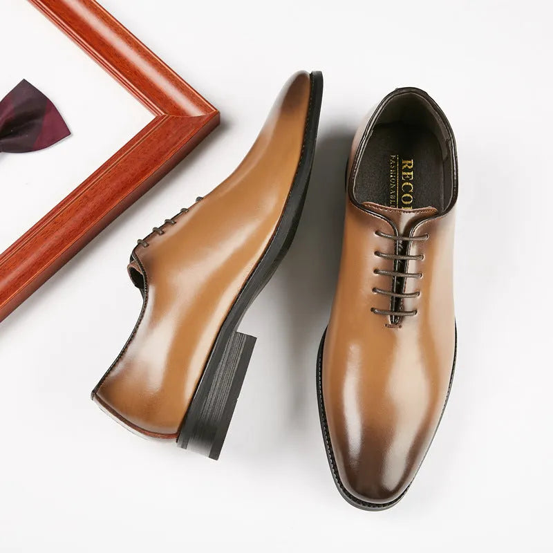 Pair of men's leather business shoes with rubber sole, small round toe, low upper, in black or brown, sizes 39-45.