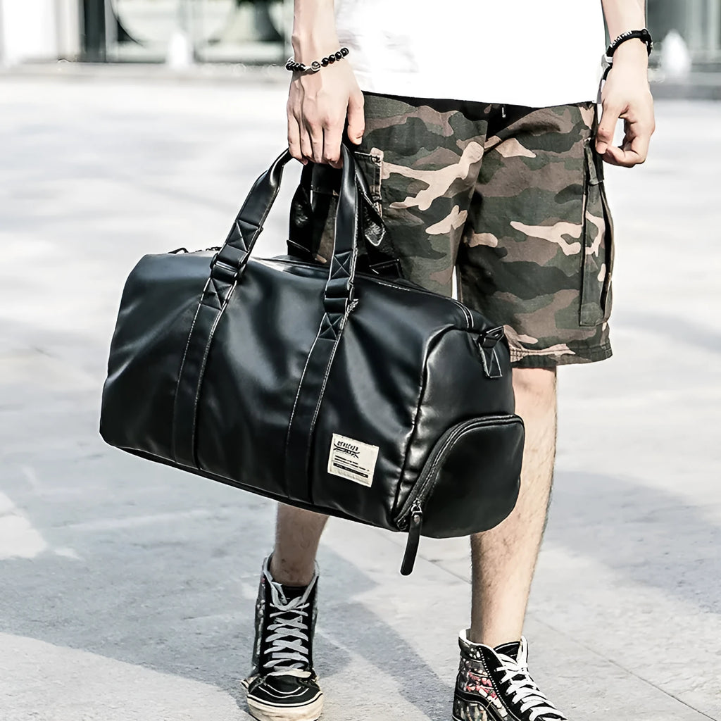 Black large capacity PU leather sports bag showing zipper opening and single shoulder strap.