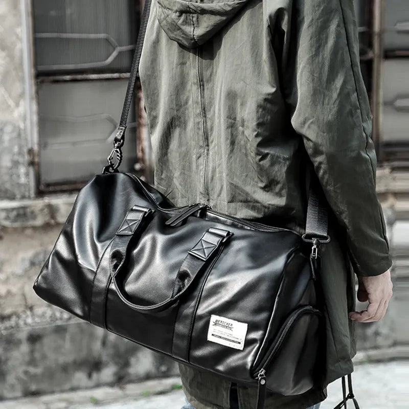 Black large capacity PU leather sports bag showing zipper opening and single shoulder strap.