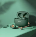 Wireless Bluetooth Mini TWS earbuds in black, white, and dark green with their compact charging case.