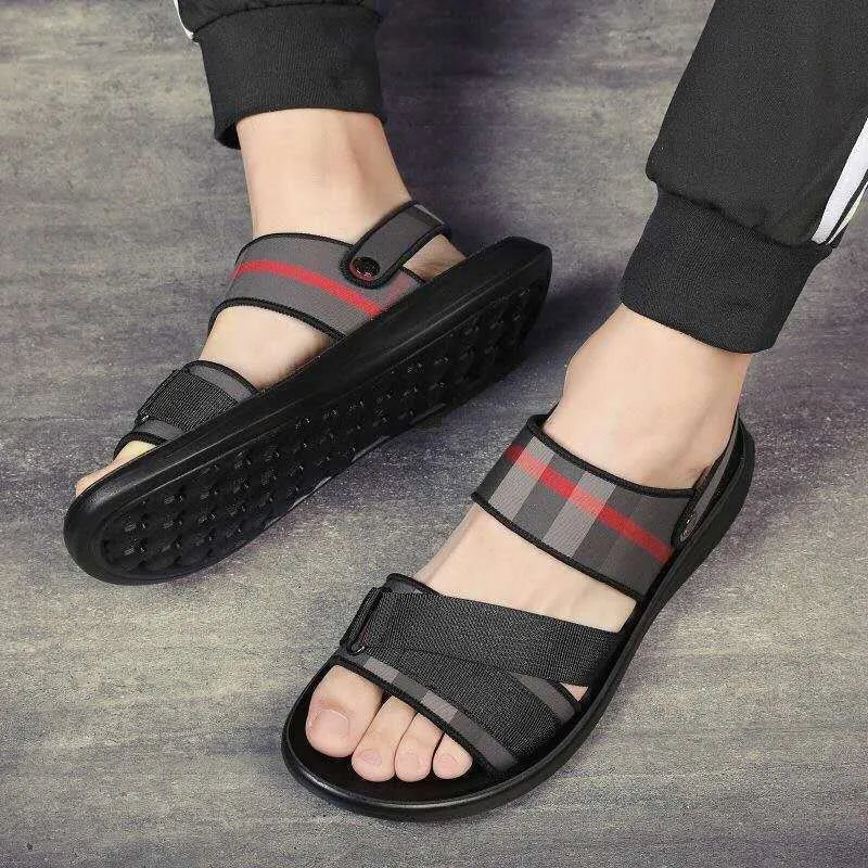 A pair of youth leisure sandals with a blue Lycra upper and polyurethane sole, shown on a white background.