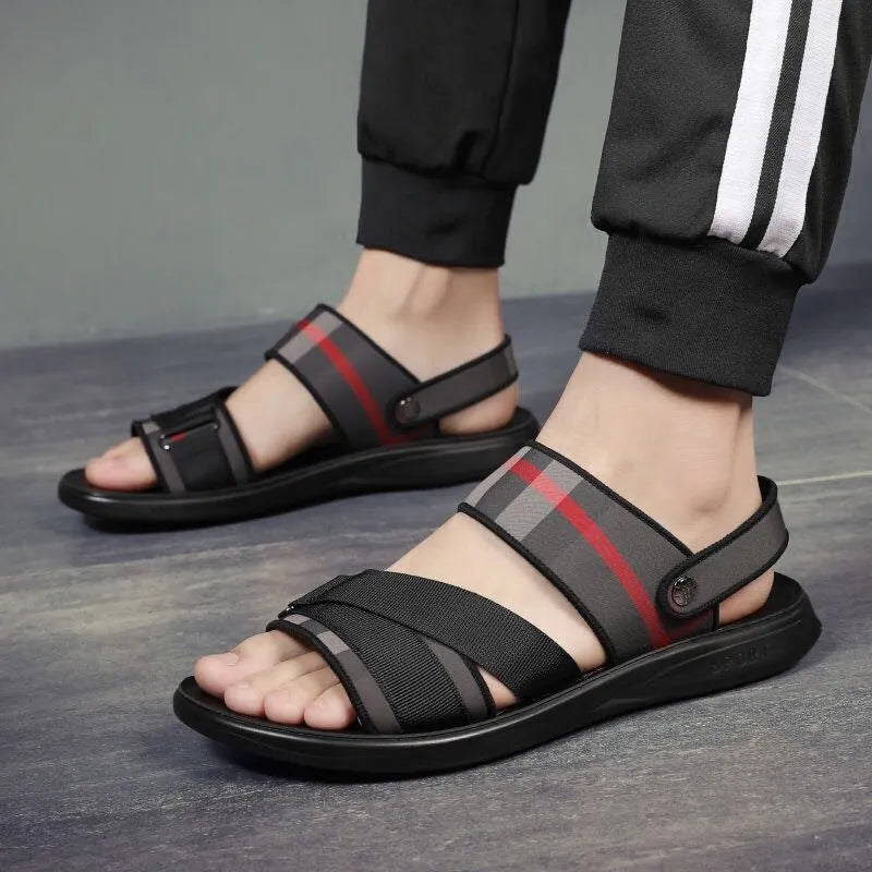 A pair of youth leisure sandals with a blue Lycra upper and polyurethane sole, shown on a white background.