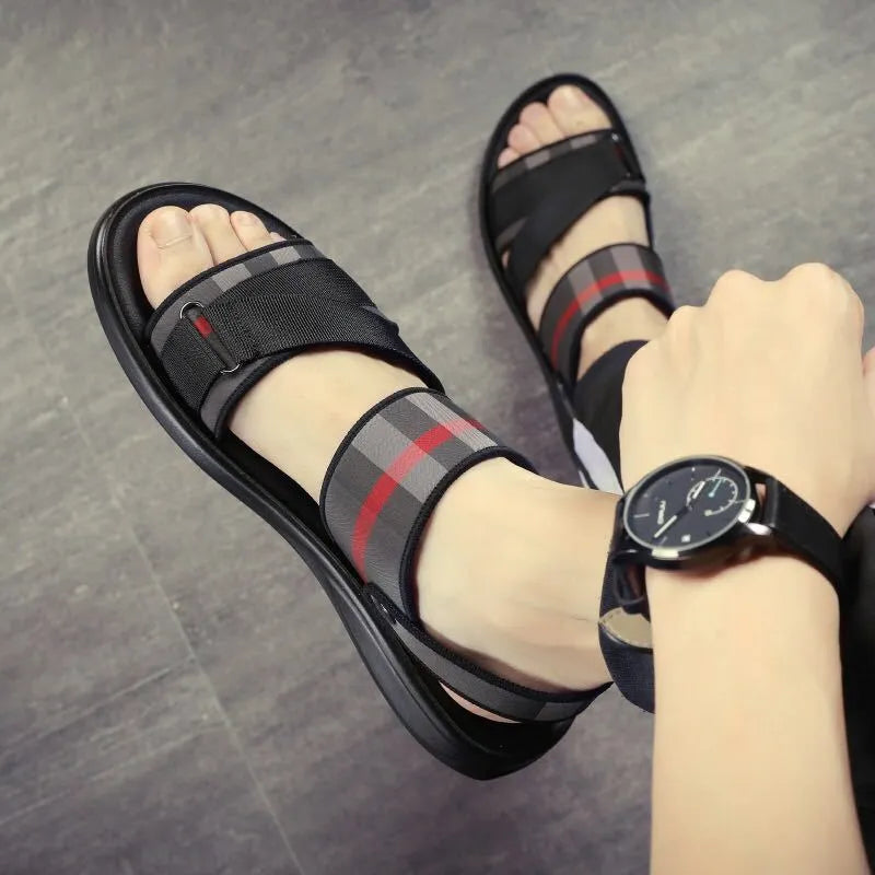 A pair of youth leisure sandals with a blue Lycra upper and polyurethane sole, shown on a white background.